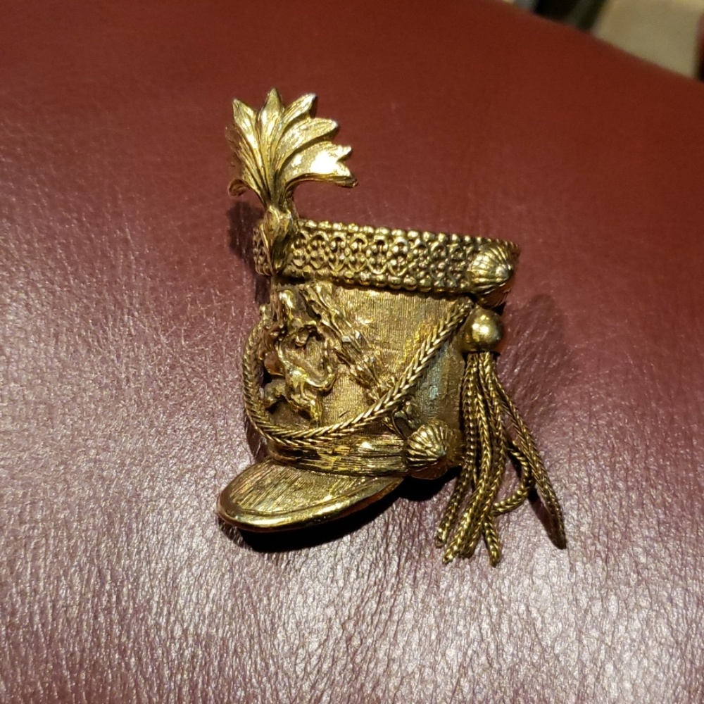 Old fashioned military helmet pin